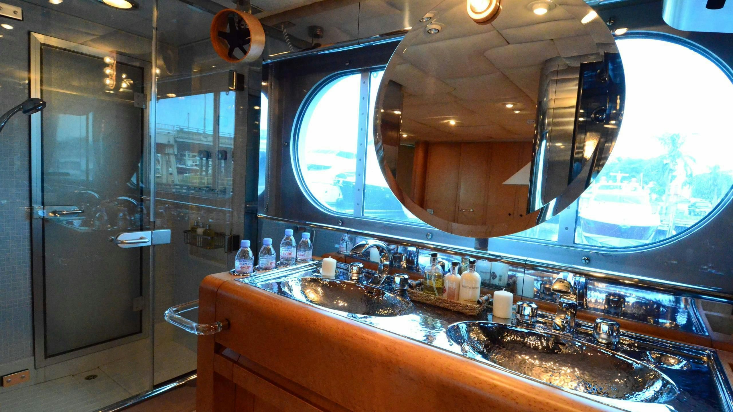a large bathroom with a large mirror aboard KORU Yacht for Charter