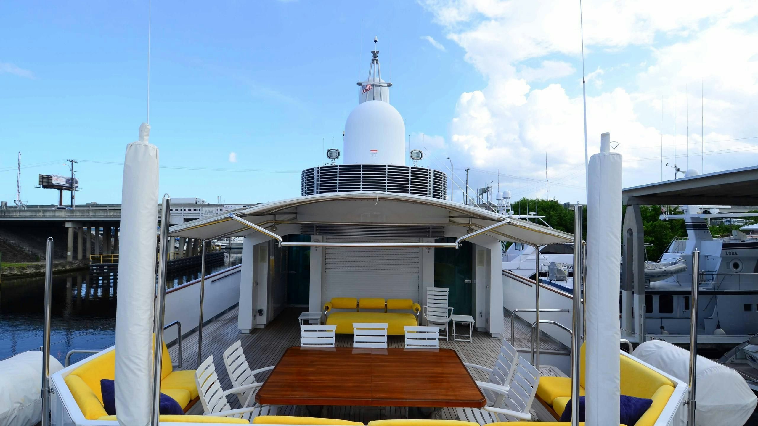 a boat dock with a building in the background aboard KORU Yacht for Charter
