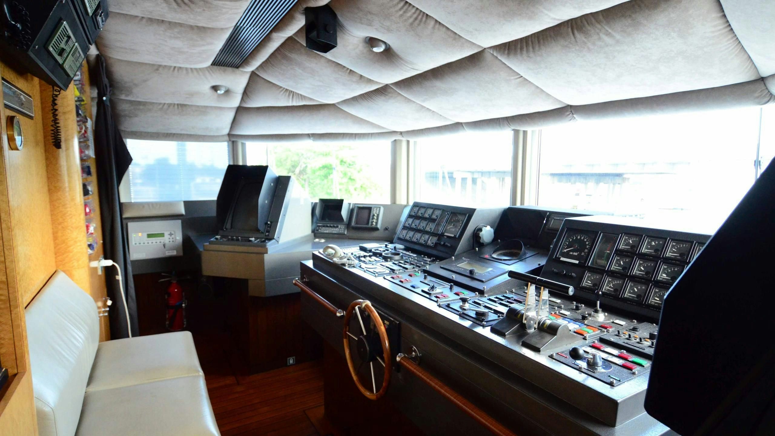 a room with a desk and a computer aboard KORU Yacht for Charter