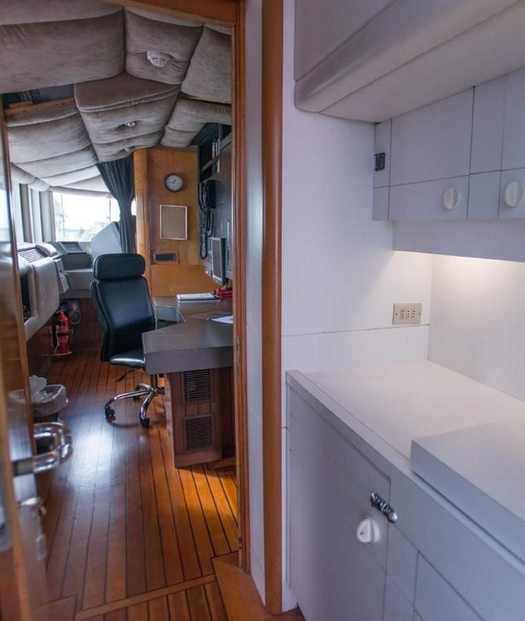a kitchen with a table and chairs aboard KORU Yacht for Charter