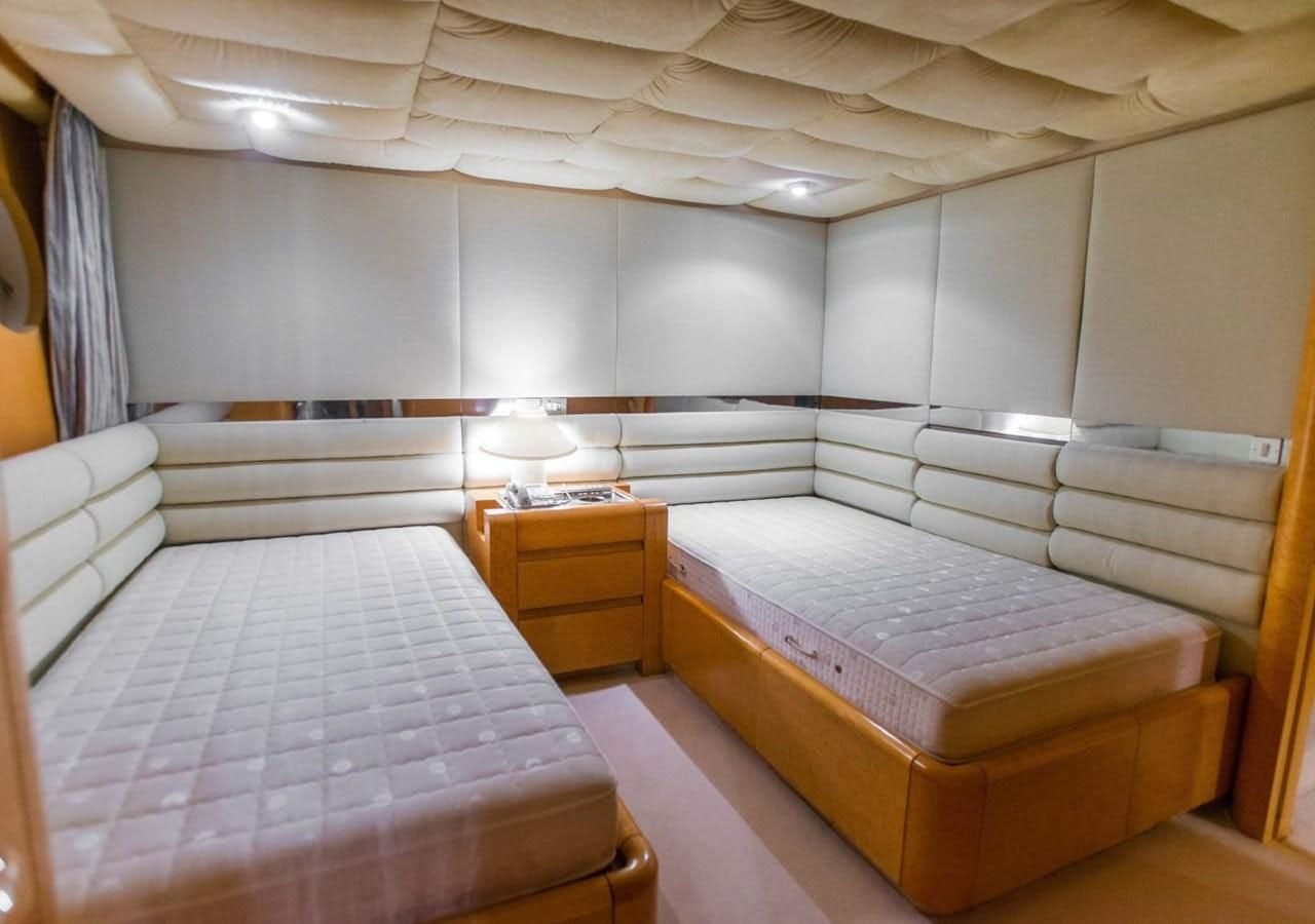 a room with two beds aboard KORU Yacht for Charter