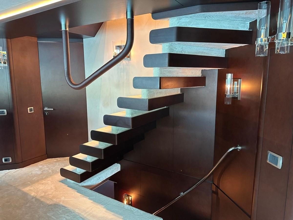 a set of stairs in a building aboard KORU Yacht for Charter