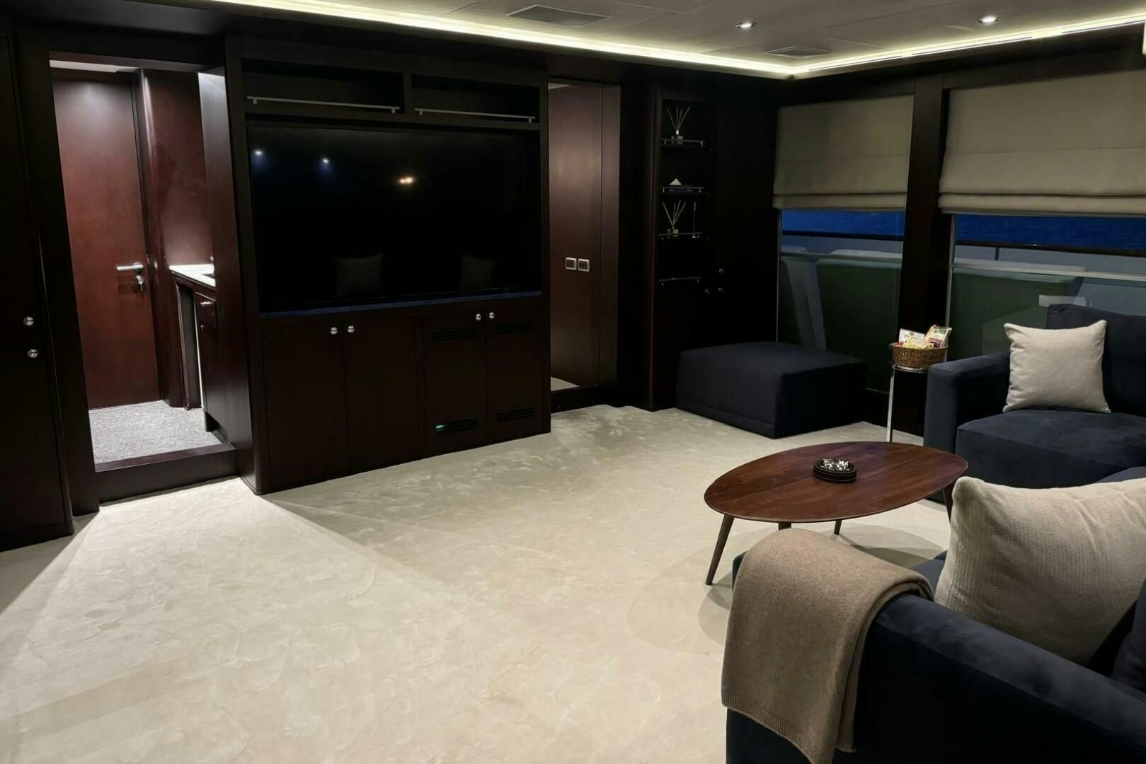 a room with a table and chairs aboard KORU Yacht for Charter