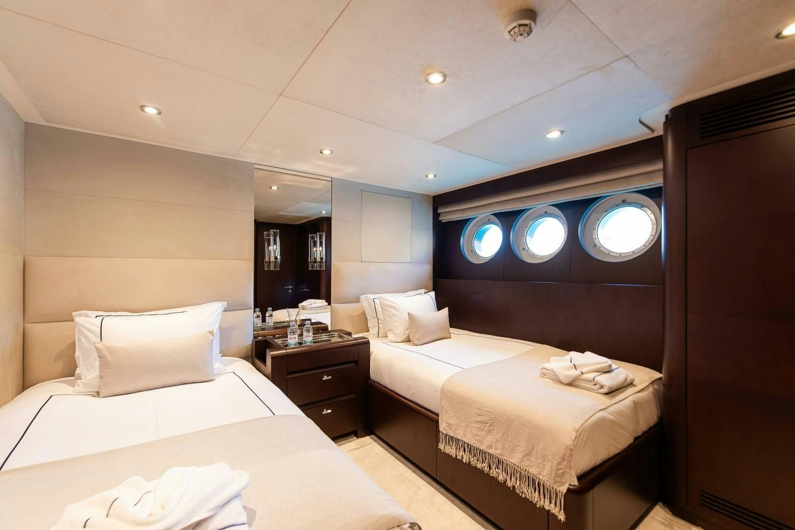 a room with two beds aboard KORU Yacht for Charter
