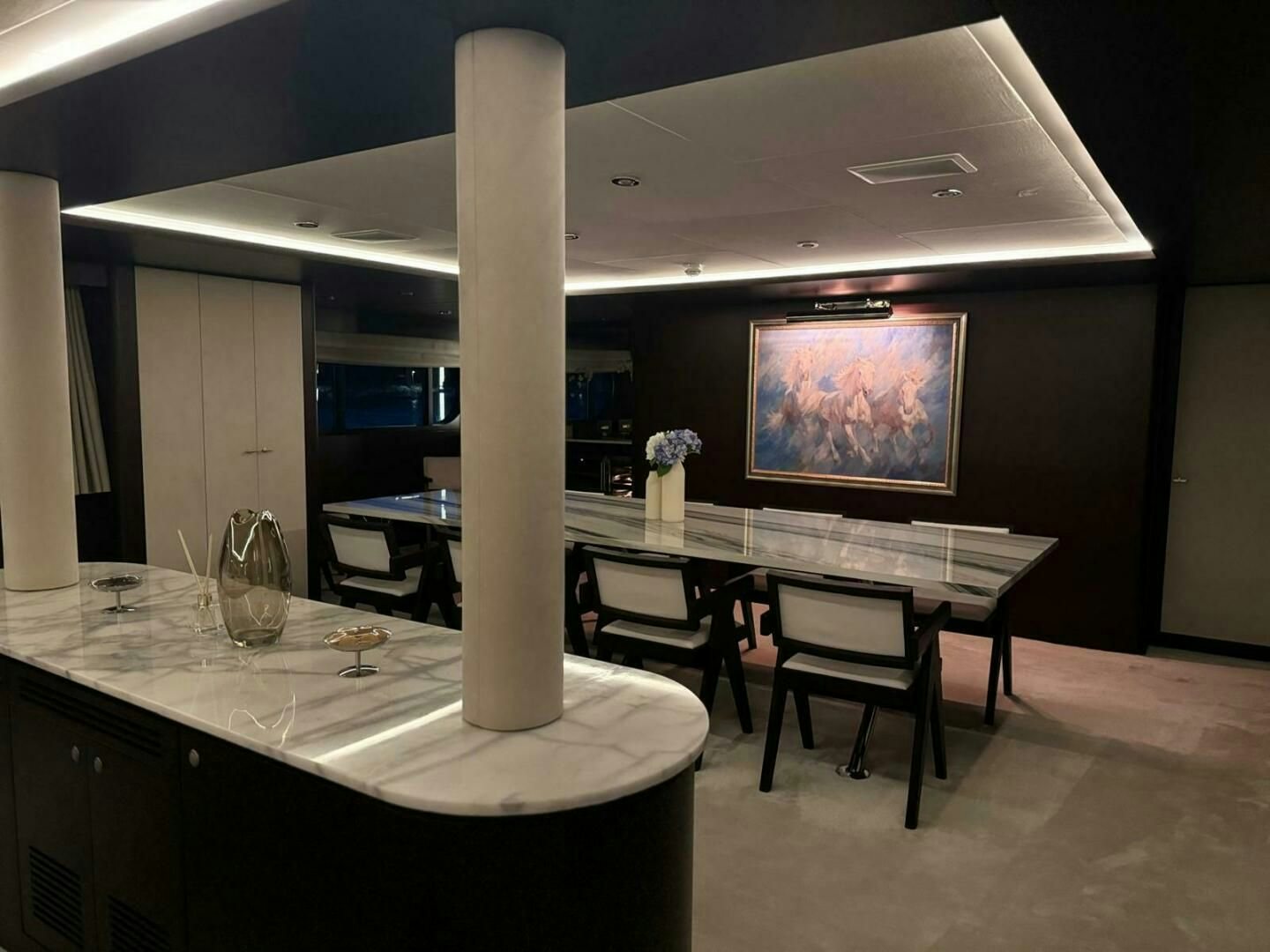 a large white column in a room aboard KORU Yacht for Charter