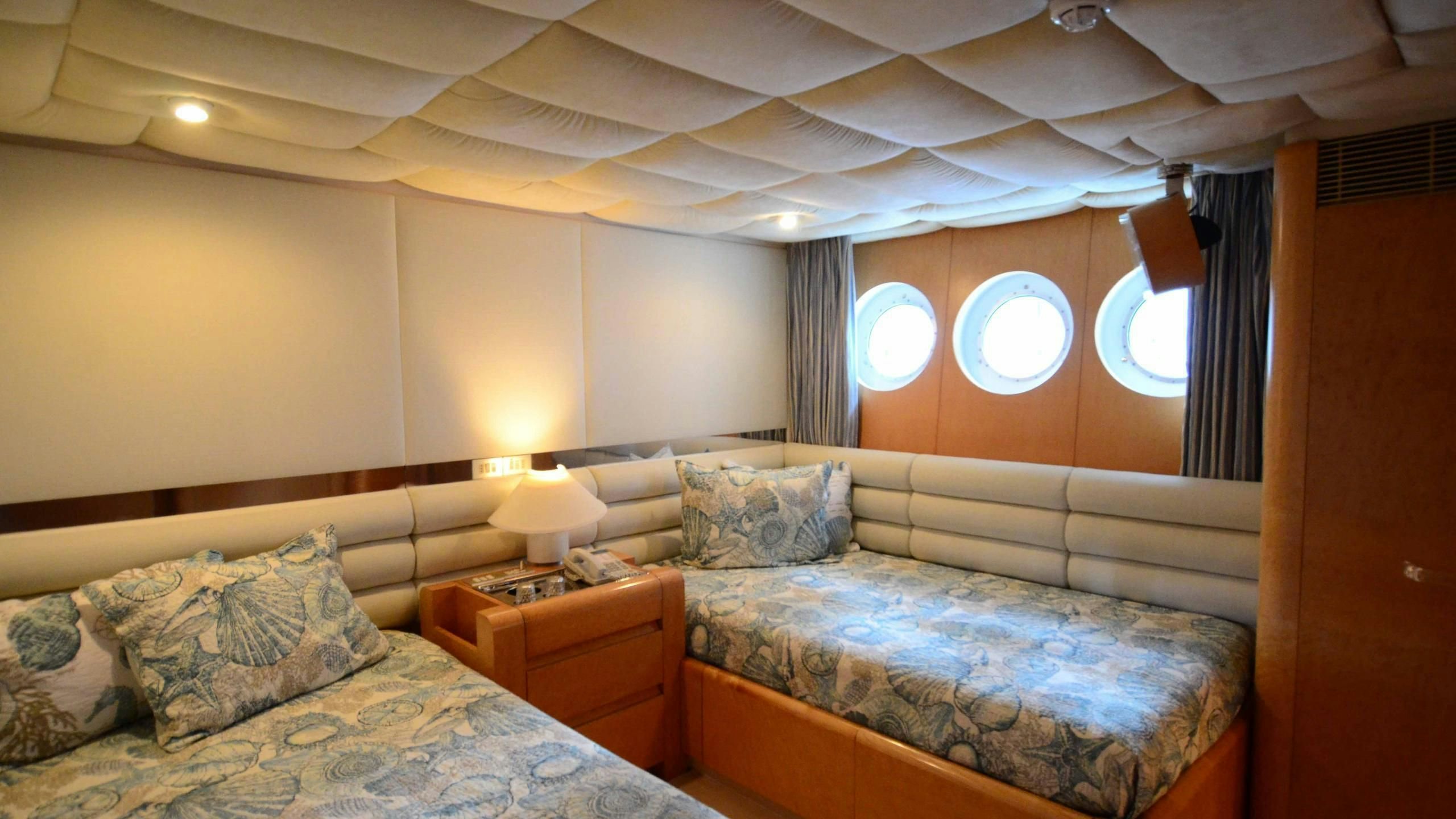 a room with two beds aboard KORU Yacht for Charter