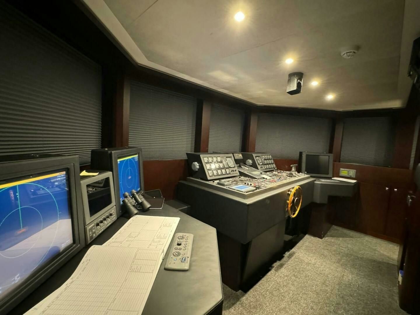 a room with computers and monitors aboard KORU Yacht for Charter