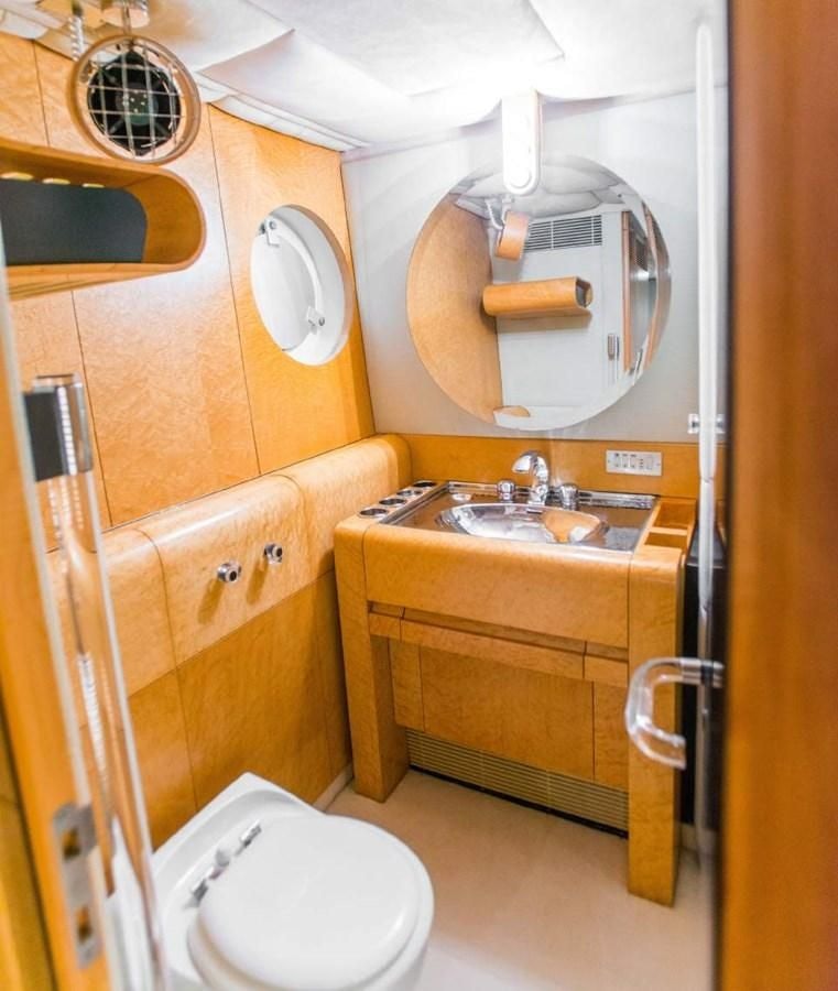 a bathroom with a toilet and sink aboard KORU Yacht for Charter