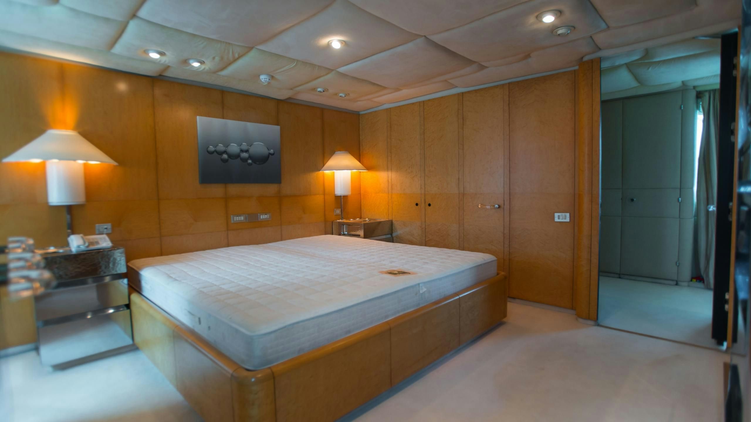a large hotel room with a large bed aboard KORU Yacht for Charter