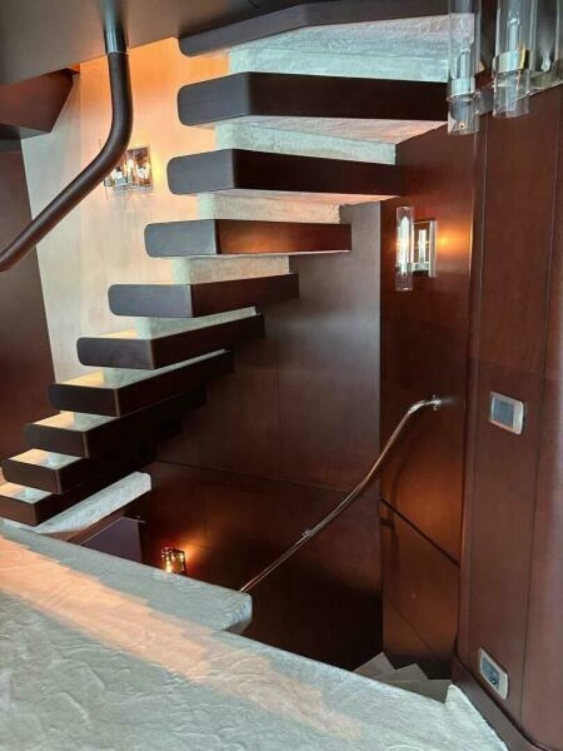 a set of stairs in a room aboard KORU Yacht for Charter