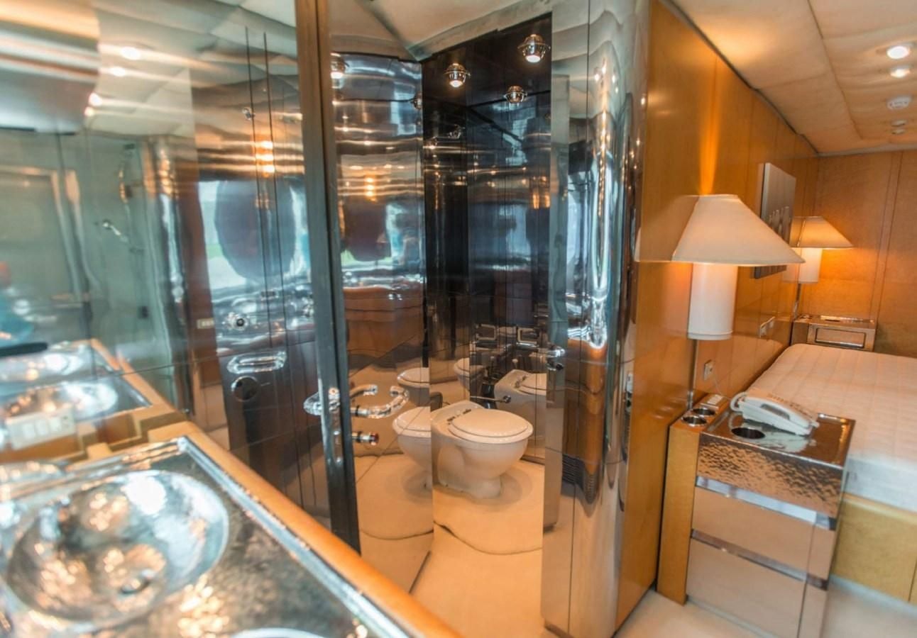 a bathroom with a glass shower aboard KORU Yacht for Charter