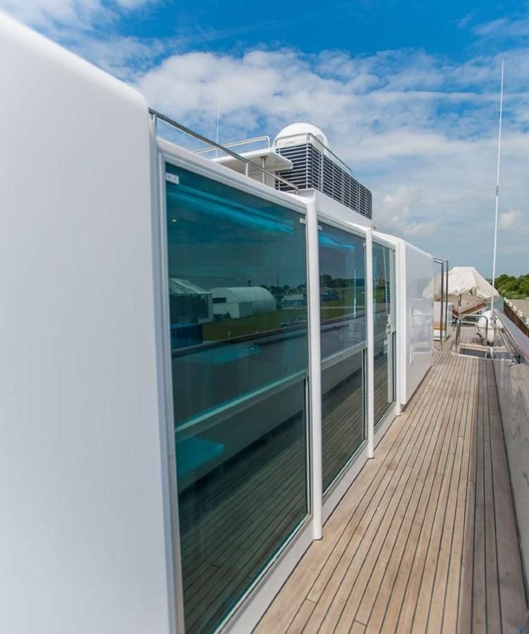 a balcony with a railing and a building with a railing aboard KORU Yacht for Charter