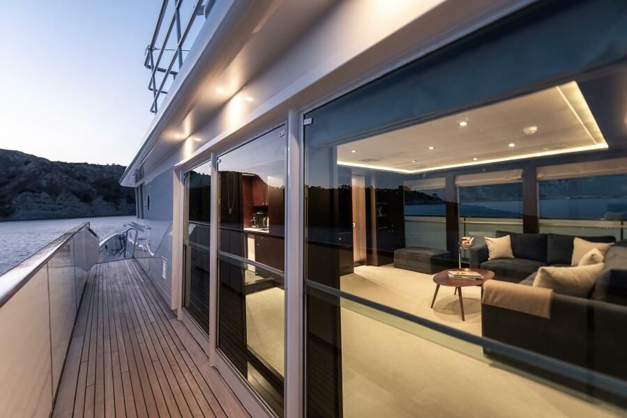 a deck with a view of the ocean and the deck aboard KORU Yacht for Charter