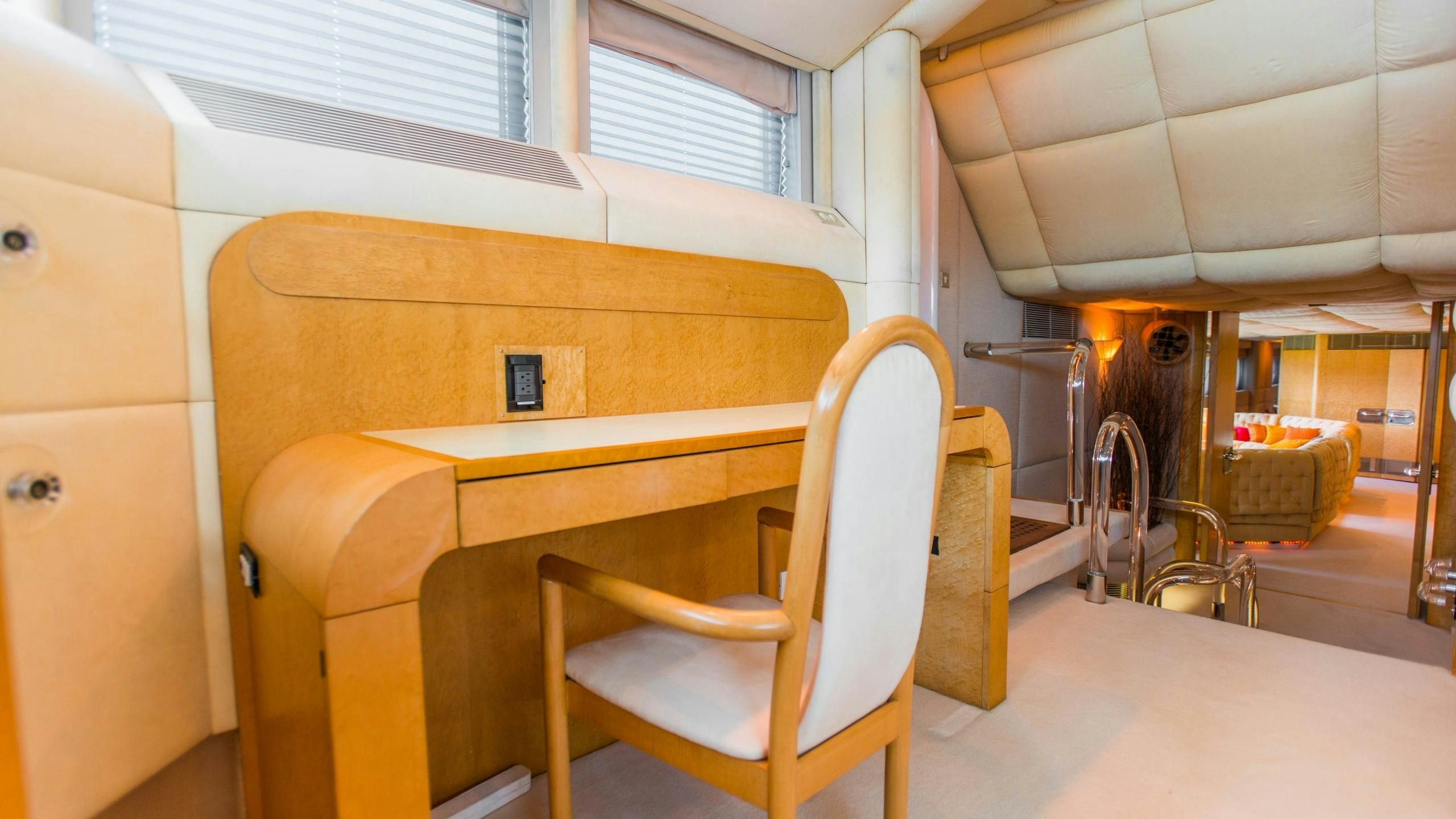 a wooden desk in a room aboard KORU Yacht for Charter