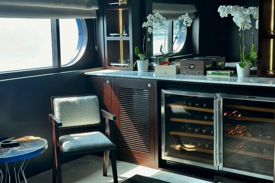 a kitchen with a glass wall aboard KORU Yacht for Charter