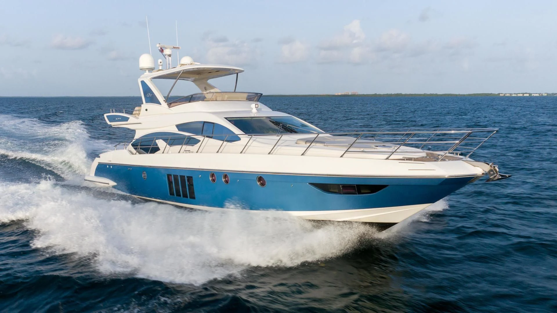 a white yacht on the water aboard 4-PLAY Yacht for Sale