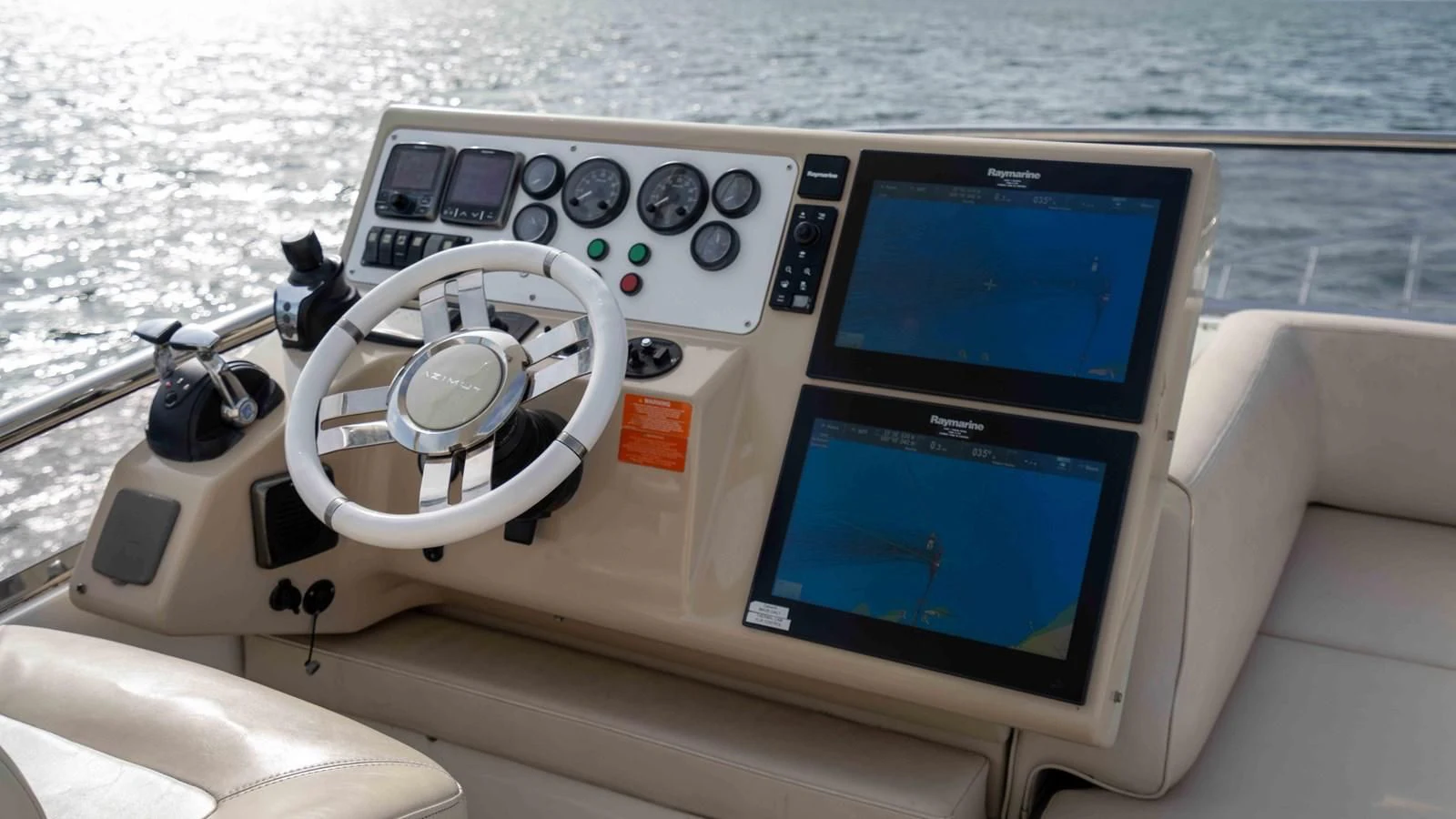 a boat with a screen and a steering wheel on the front aboard 4-PLAY Yacht for Sale