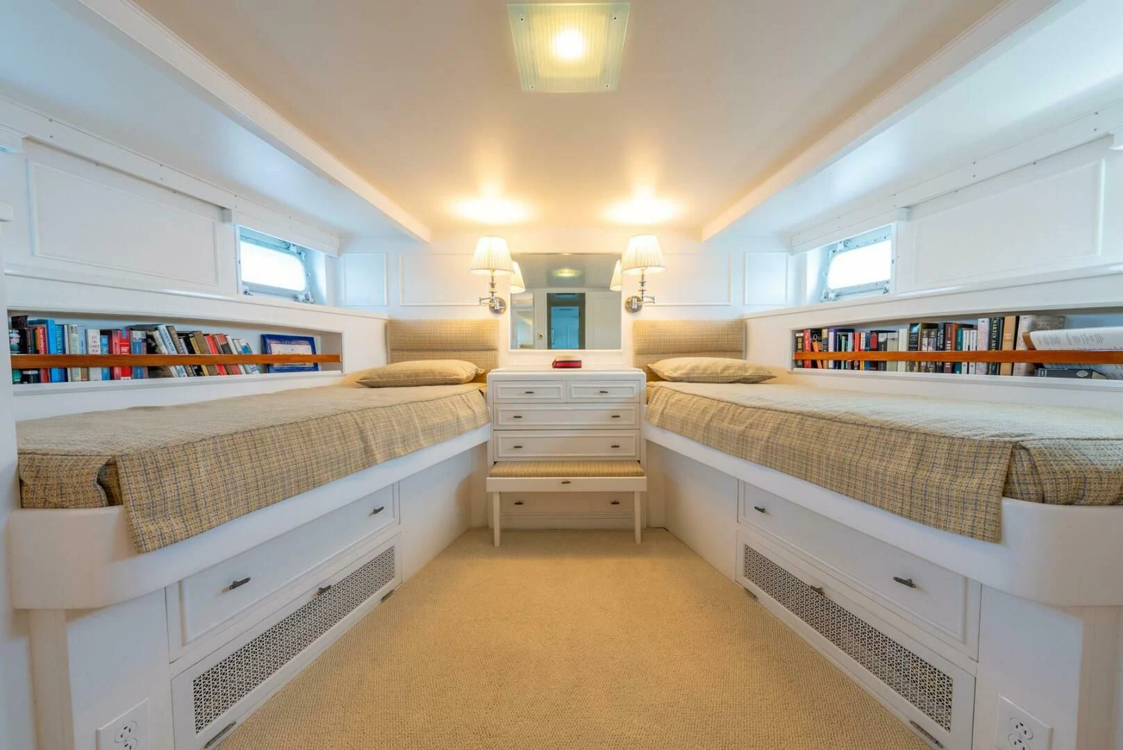 a room with a couple of beds aboard BERNADETTE Yacht for Sale