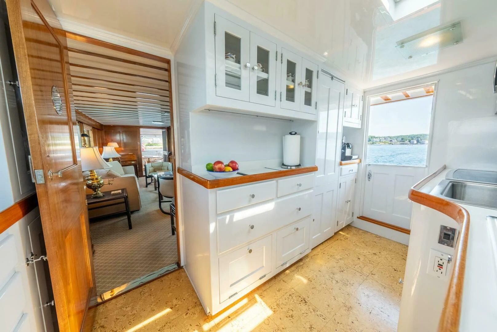 a kitchen with white cabinets aboard BERNADETTE Yacht for Sale