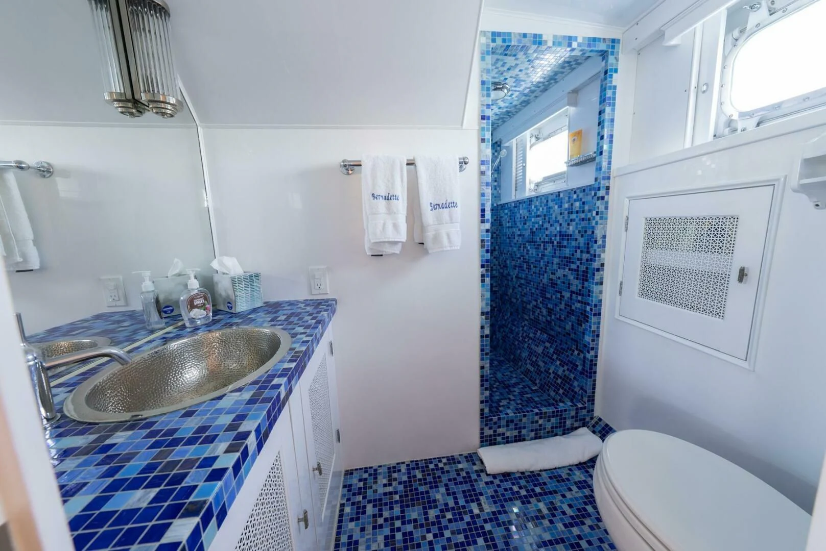 a bathroom with a sink and toilet aboard BERNADETTE Yacht for Sale
