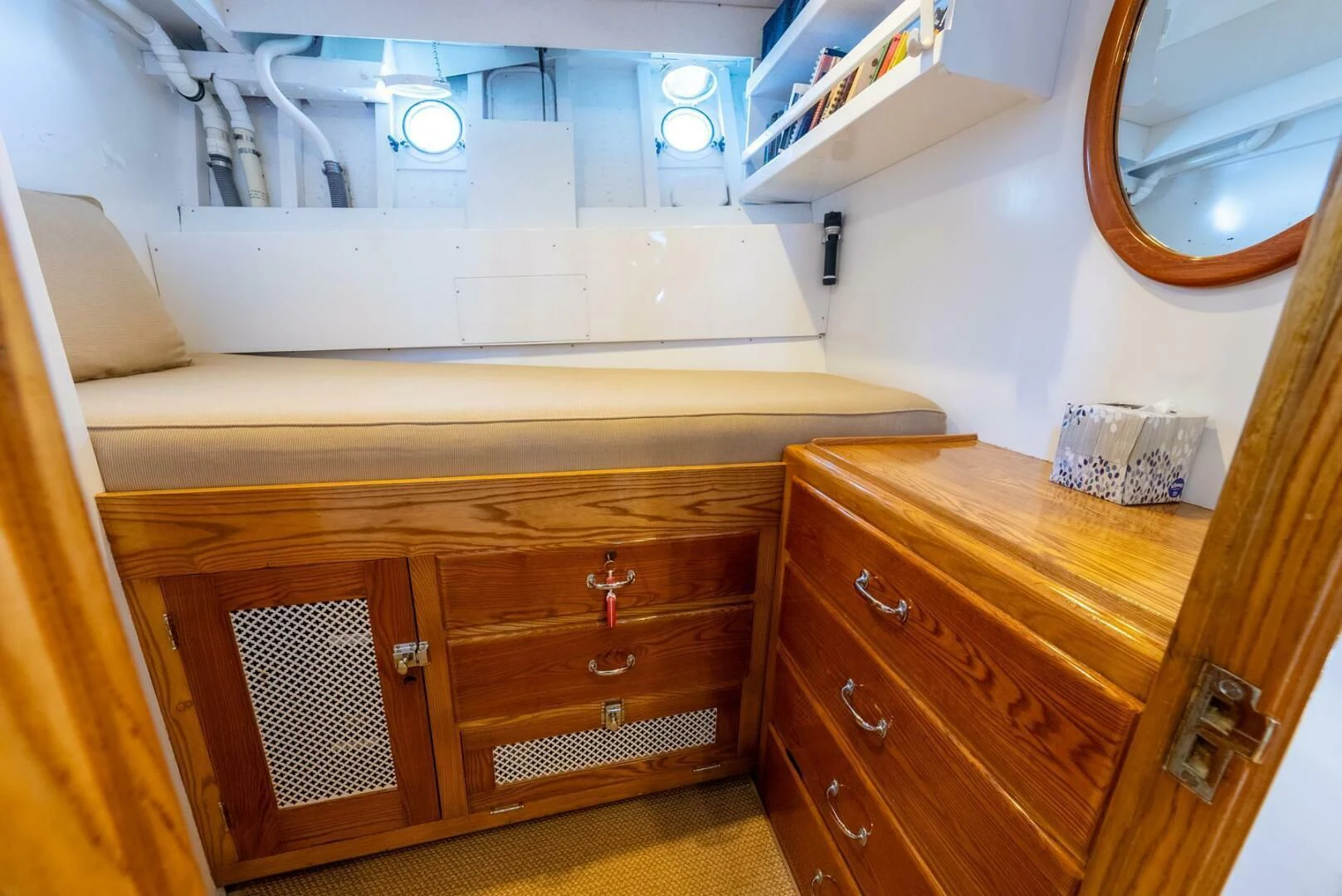 a dresser and a mirror in a room aboard BERNADETTE Yacht for Sale