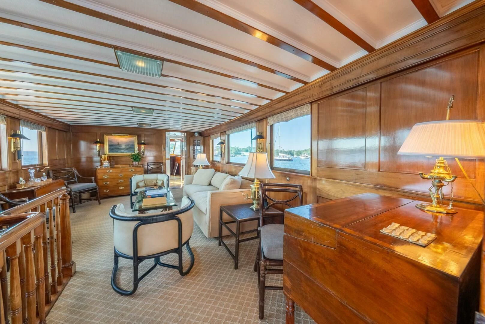a room with a table chairs and a large window aboard BERNADETTE Yacht for Sale