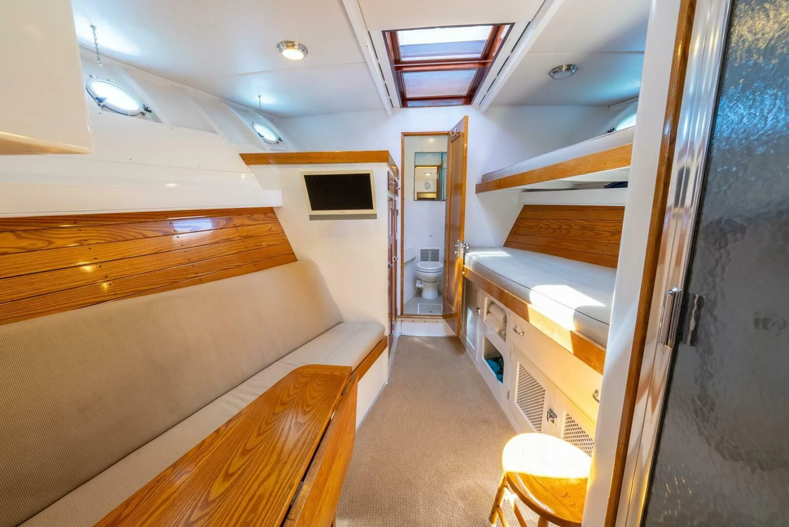 a room with a bed and a desk aboard BERNADETTE Yacht for Sale