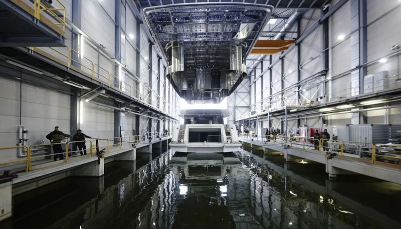 a large building with a bridge aboard AZAMANTA Yacht for Sale