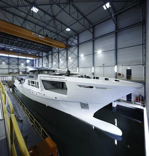 a white yacht in a large building aboard AZAMANTA Yacht for Sale