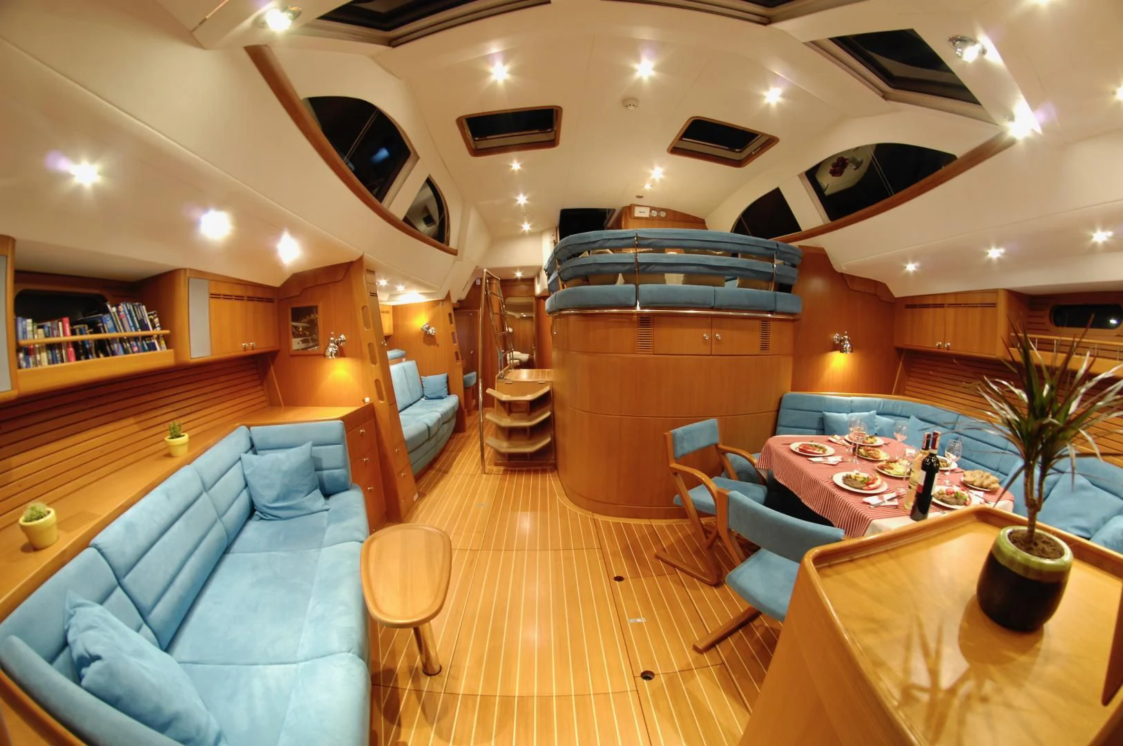 a room with a bed and a table aboard PULSAR II Yacht for Sale