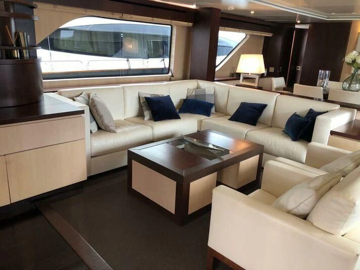 a living room with a large window aboard AKUA Yacht for Sale