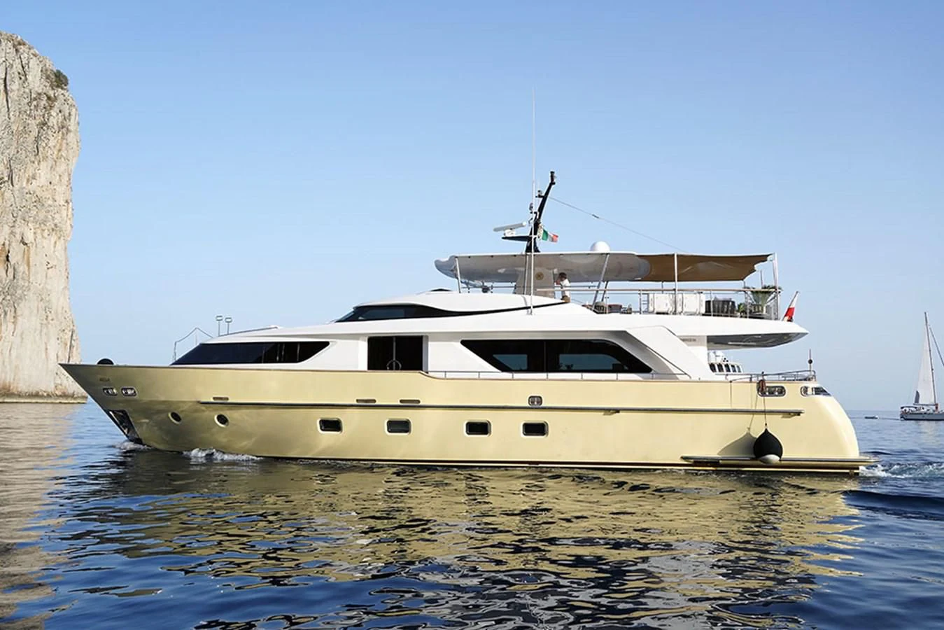 a white yacht in the water aboard AKUA Yacht for Sale