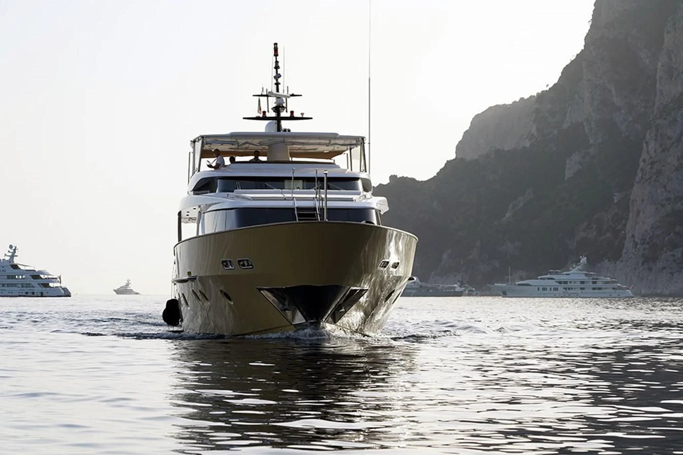 a large ship in the water aboard AKUA Yacht for Sale