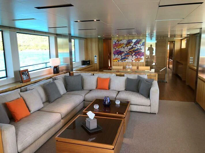 a living room with a couch and a coffee table aboard ST. BARTH Yacht for Sale