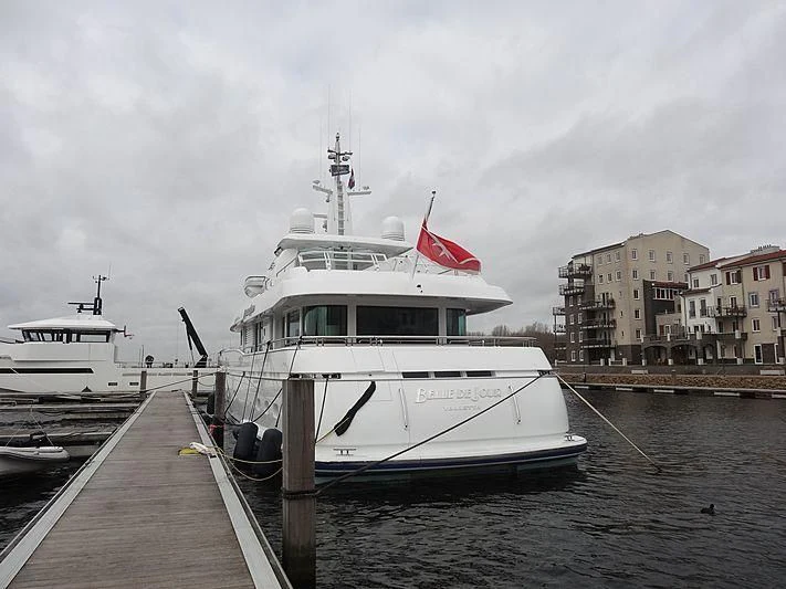 a boat docked at a pier aboard BELLE DE JOUR Yacht for Sale