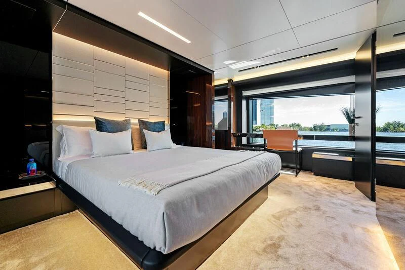 a large bed in a room aboard BESO Yacht for Sale