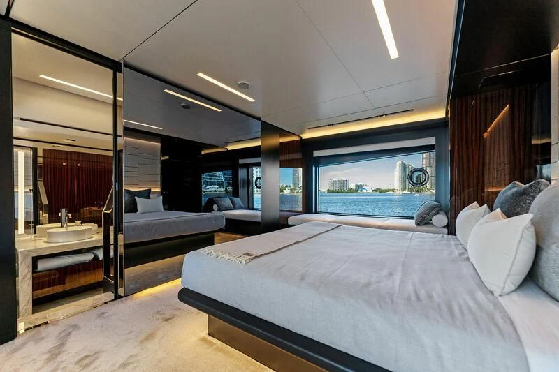 a bedroom with a large bed aboard BESO Yacht for Sale