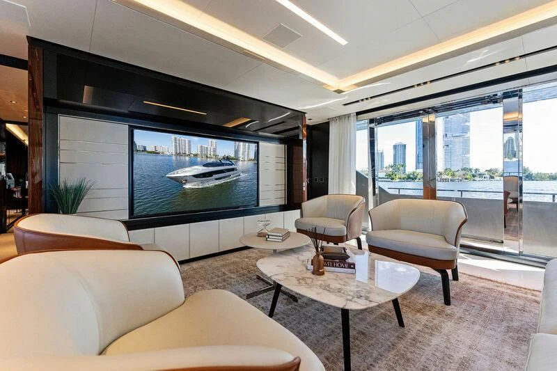 a living room with a large glass window aboard BESO Yacht for Sale