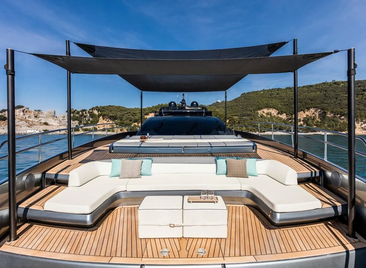 a deck with a large boat on it and a large black tank on the deck aboard BESO Yacht for Sale