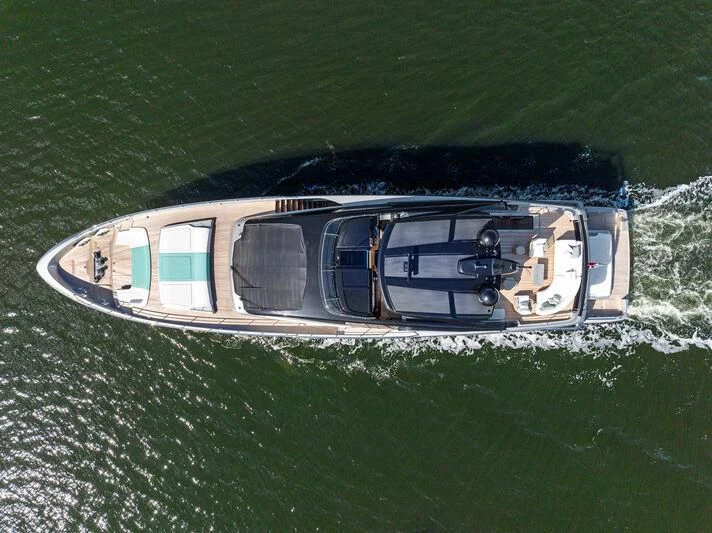 a helicopter flying over a field aboard BESO Yacht for Sale
