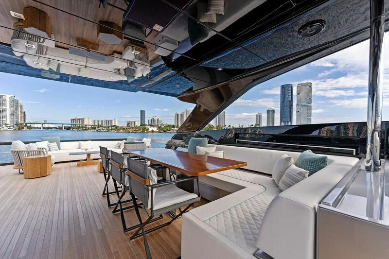 a room with a table and chairs aboard BESO Yacht for Sale