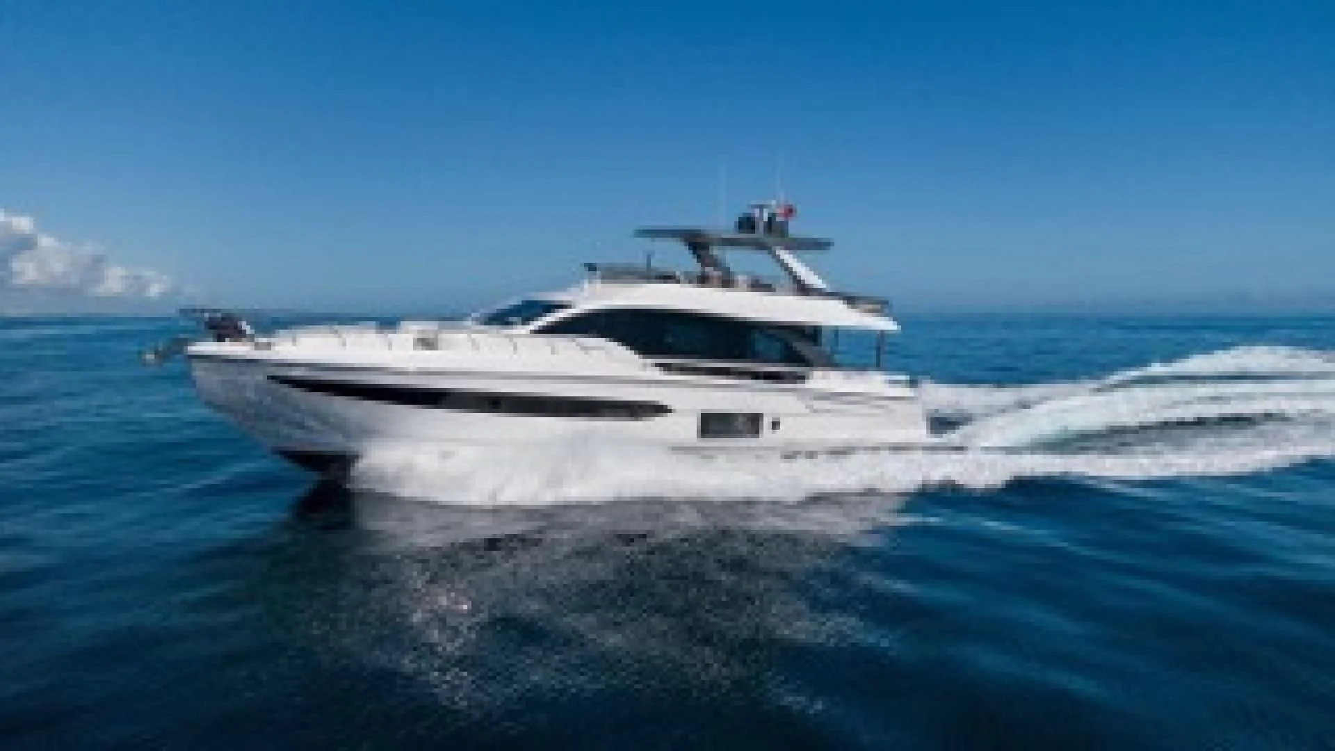a white yacht on the water aboard SUN LIFE Yacht for Sale
