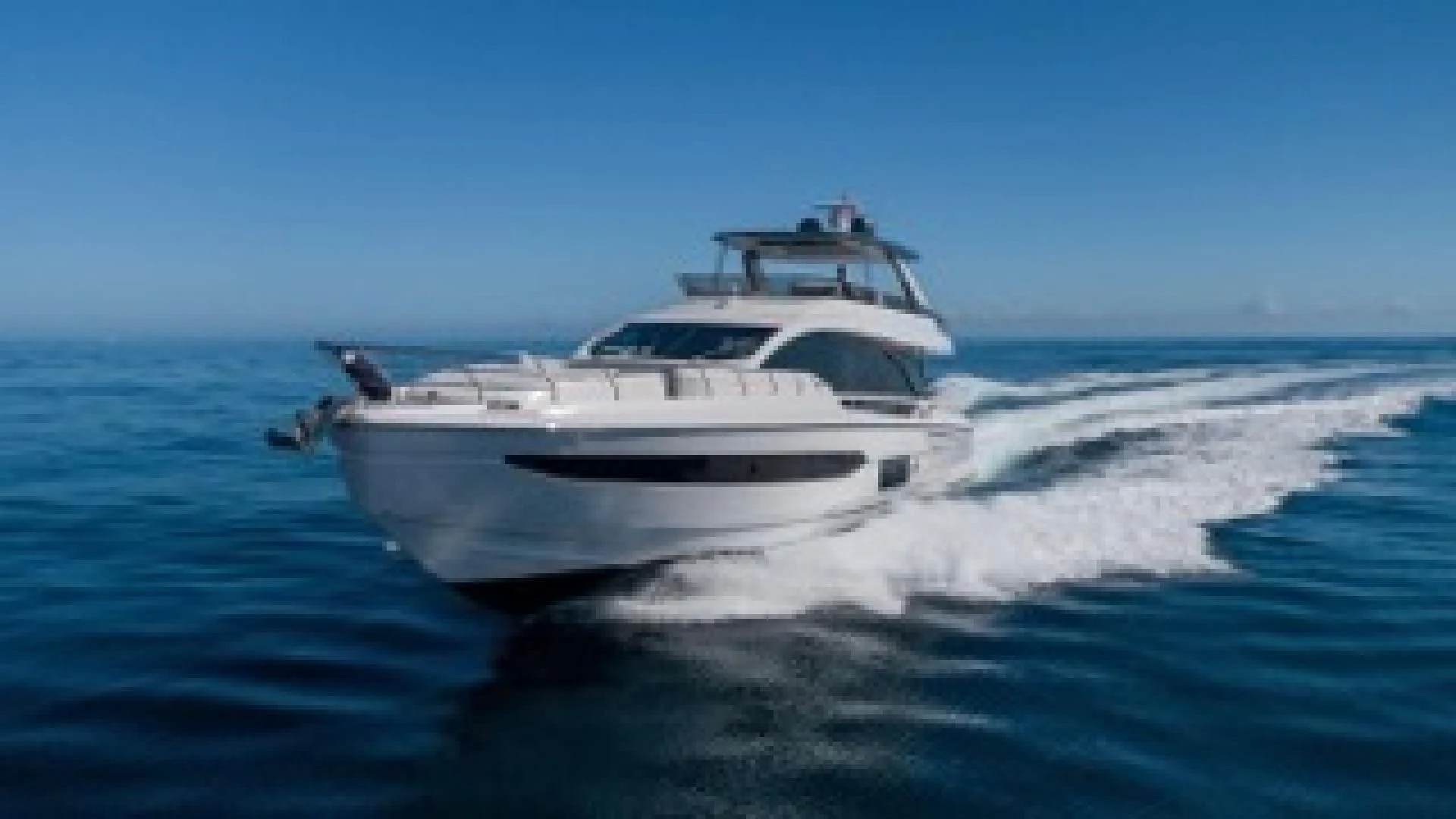 a white yacht on the water aboard SUN LIFE Yacht for Sale