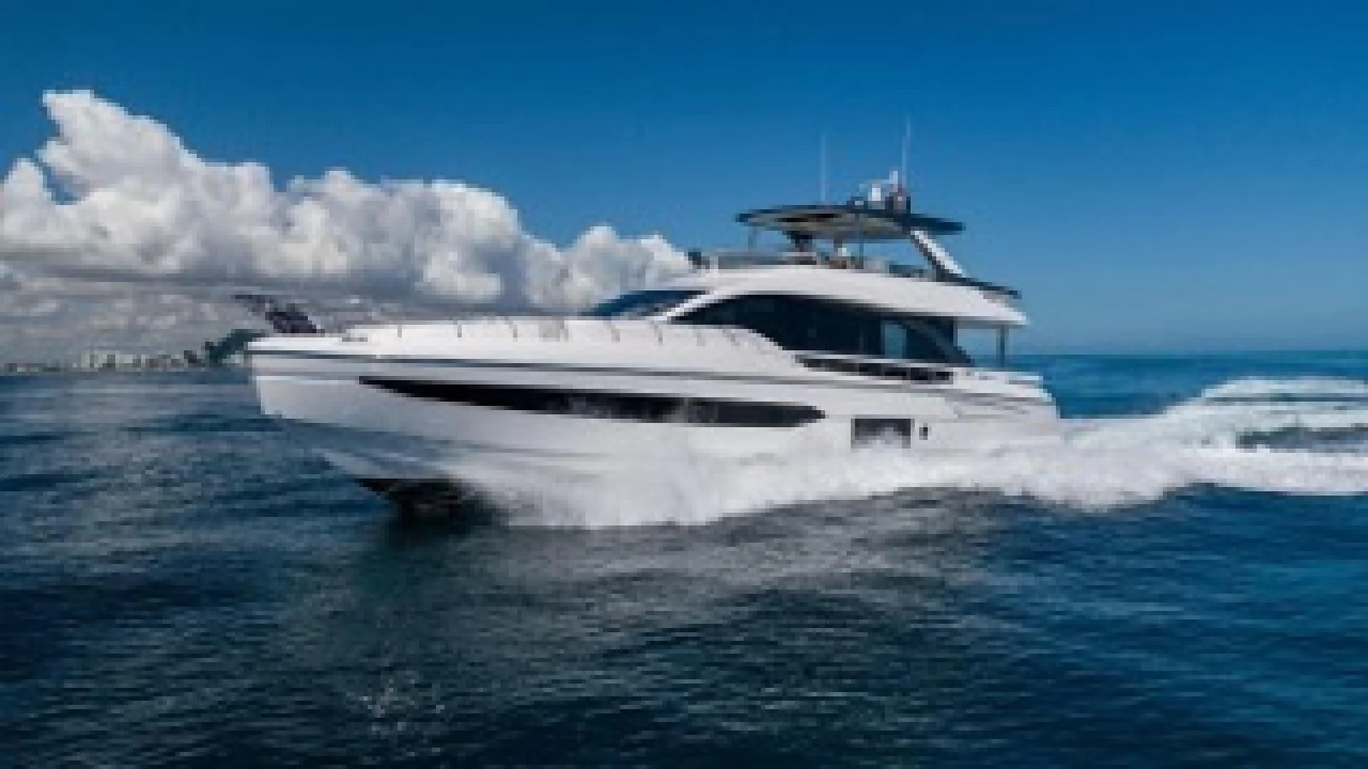 a white yacht on the water aboard SUN LIFE Yacht for Sale
