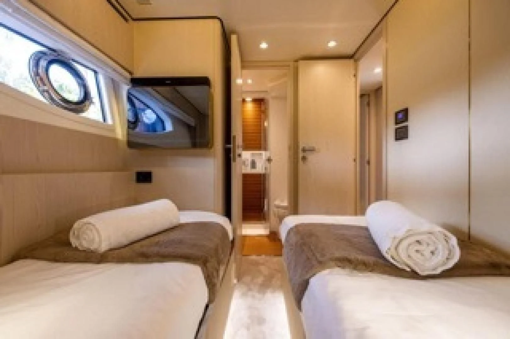 a room with a bed and a tv on the wall aboard SUN LIFE Yacht for Sale