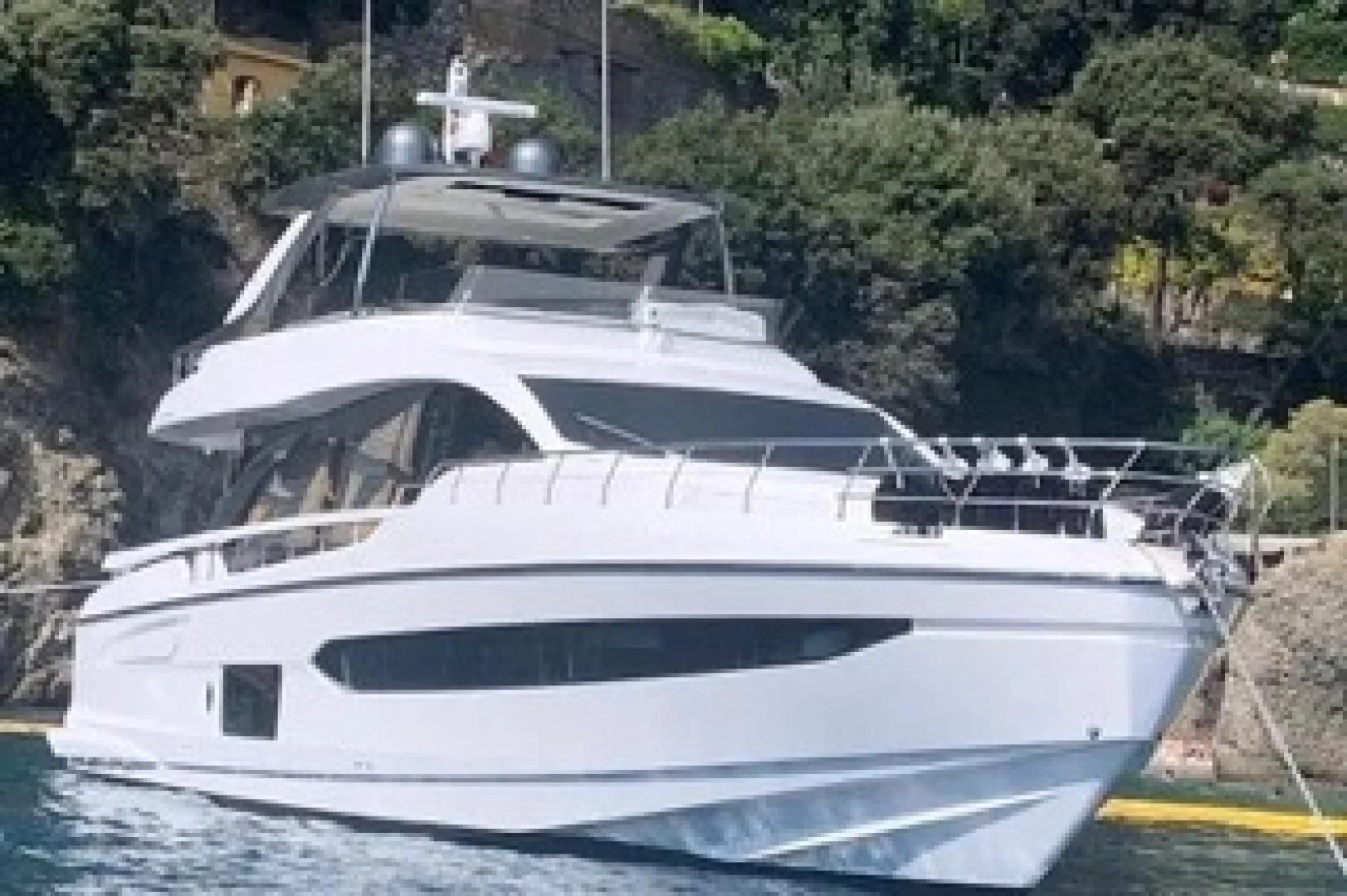 a white yacht in a harbor aboard SUN LIFE Yacht for Sale