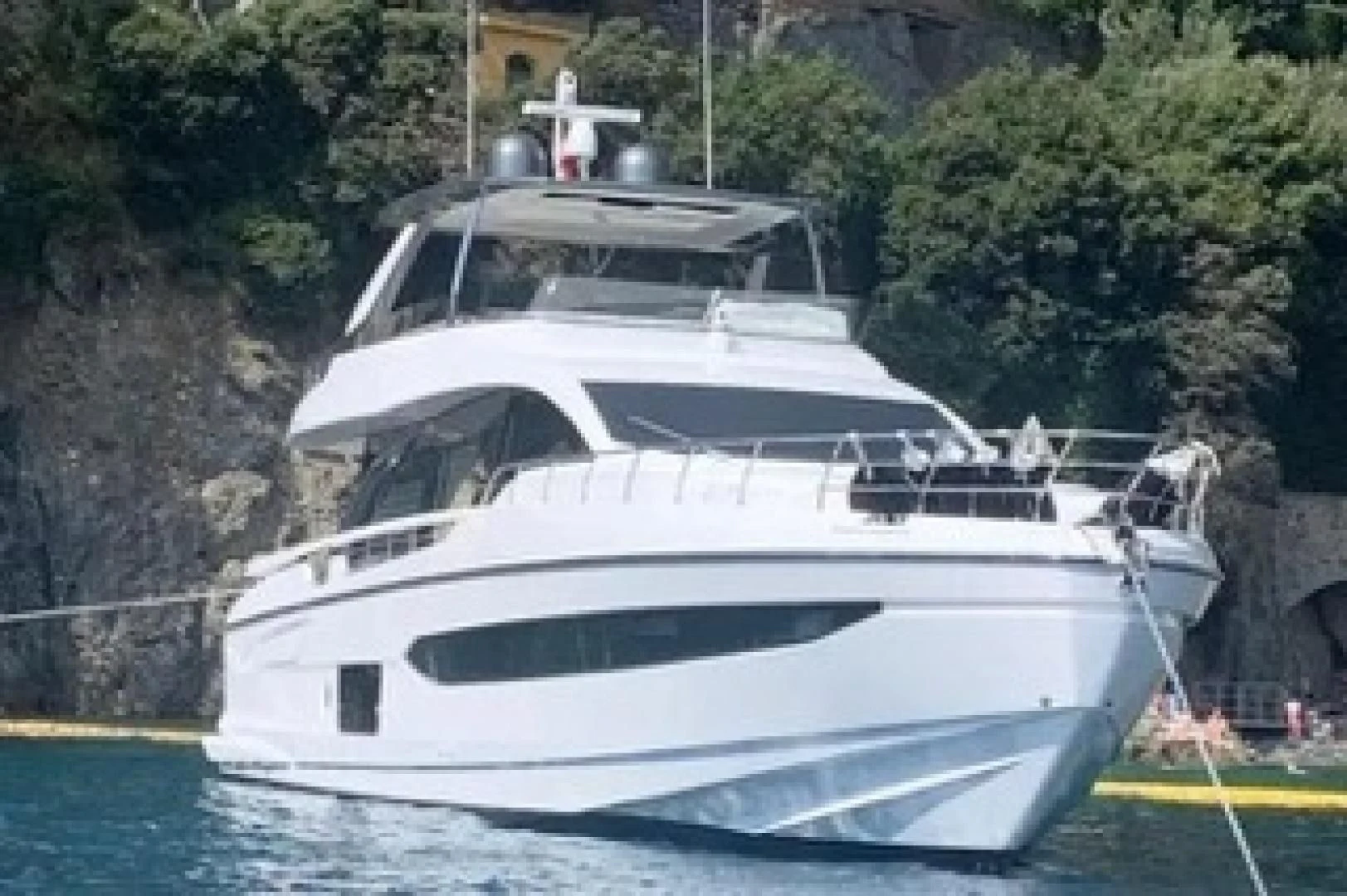a white boat in a body of water aboard SUN LIFE Yacht for Sale