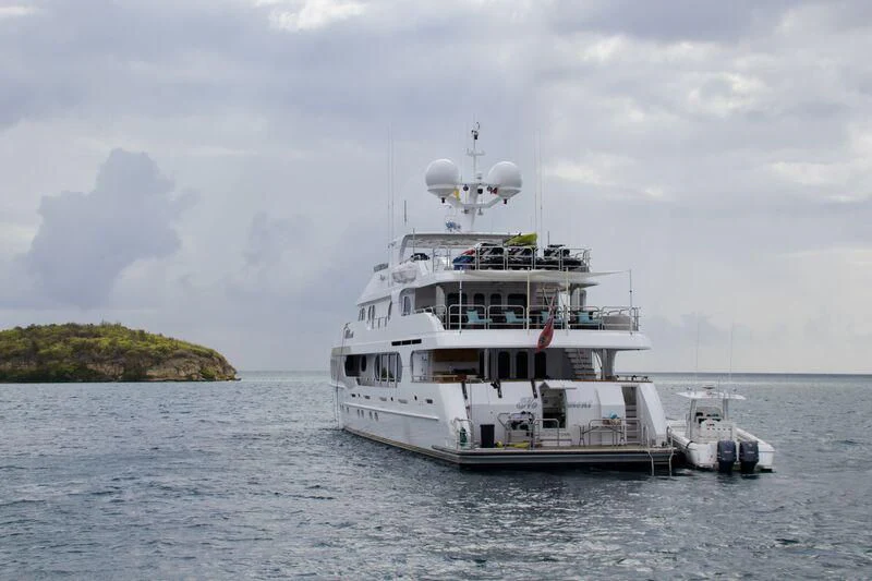 a large white boat in the water aboard NO COMMENT Yacht for Sale