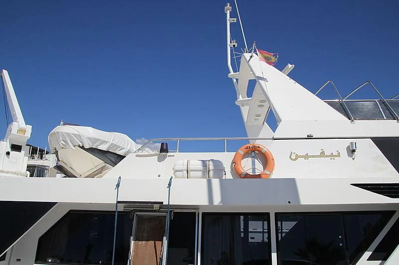 a white boat with a blue sky aboard NEEVEEN Yacht for Sale