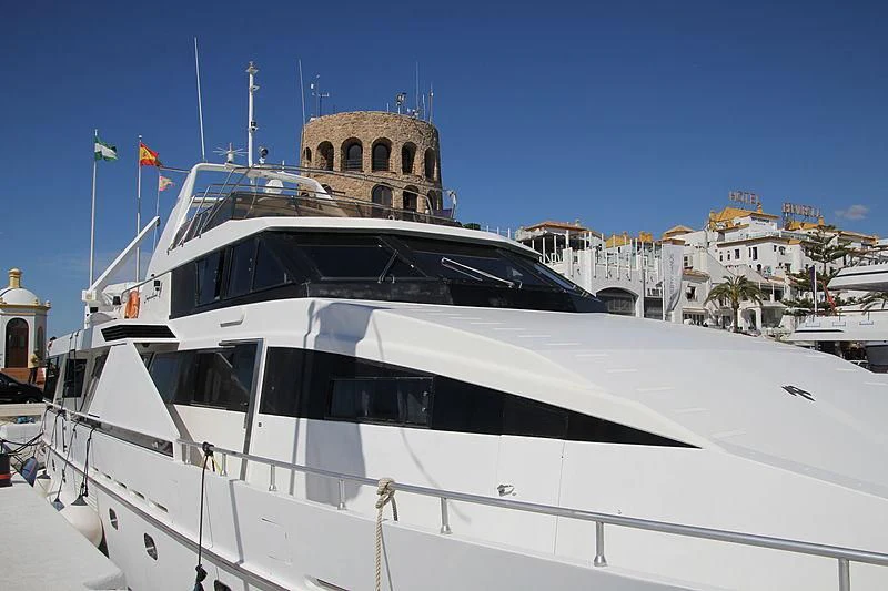 a large white boat in a harbor aboard NEEVEEN Yacht for Sale